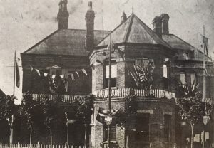 model 2-storey town building with large hexagonal bay window