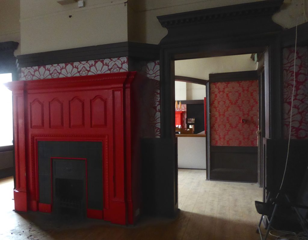 Fireplace and another through a doorway