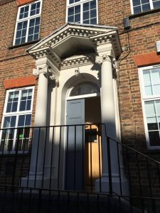 fine classic portico with curled column tops