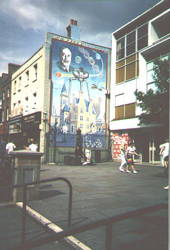 mural of tripod machines towering over brick market hall