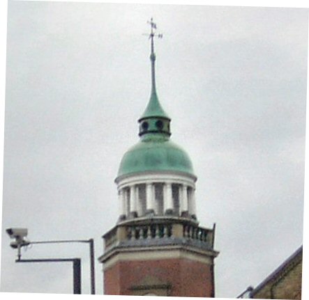 stylish copper green cupula on hexagonal tower