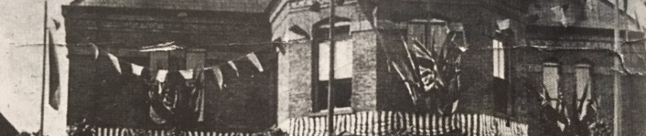 model 2-storey town building with large hexagonal bay window
