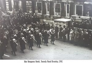 bandsmen marching past town hall
