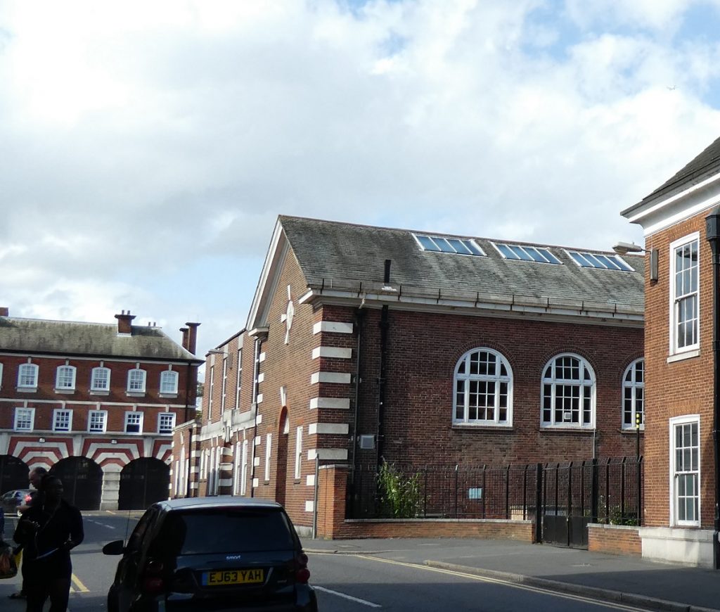 double height single storey building with 3 arched windows