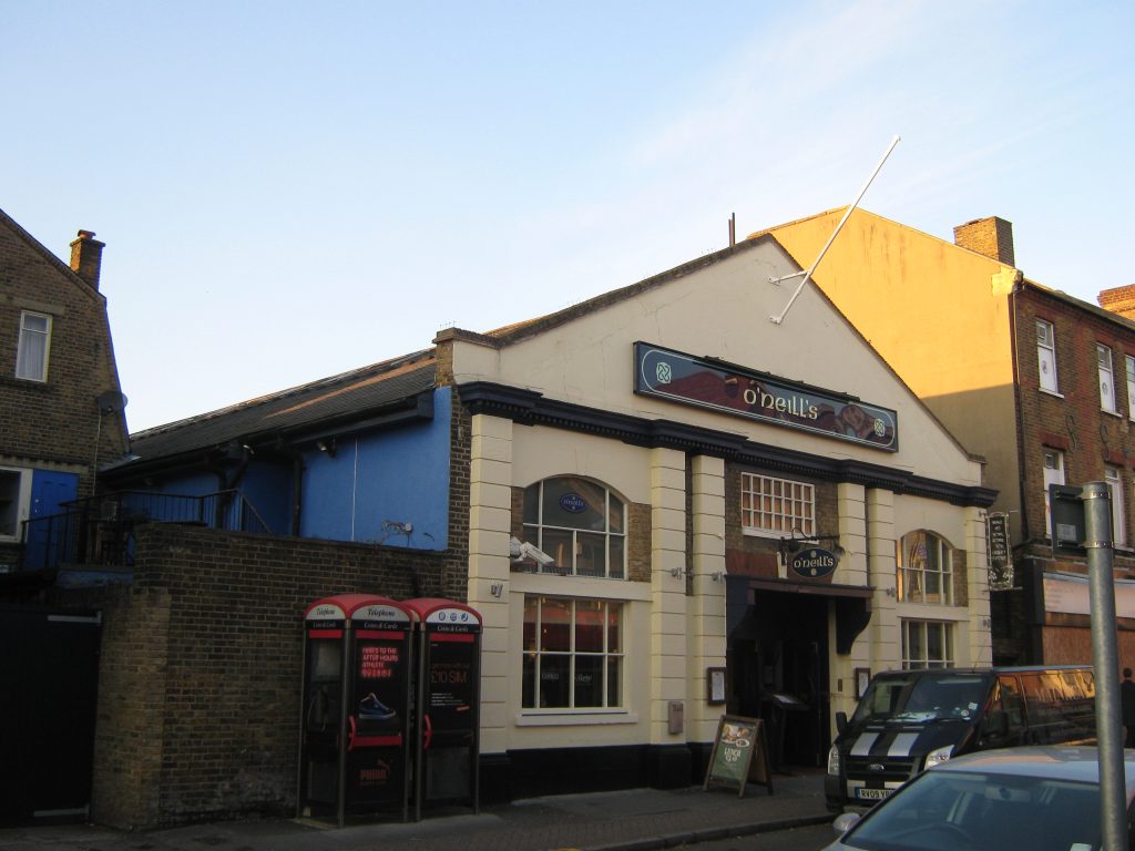 a white washed pitched roofed hall