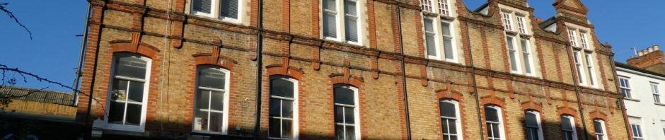 fine 3-storey shop terrace with triangular pediments over dormer windows
