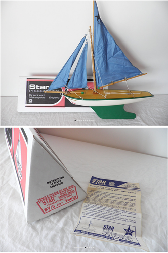 toy yacht with blue sail